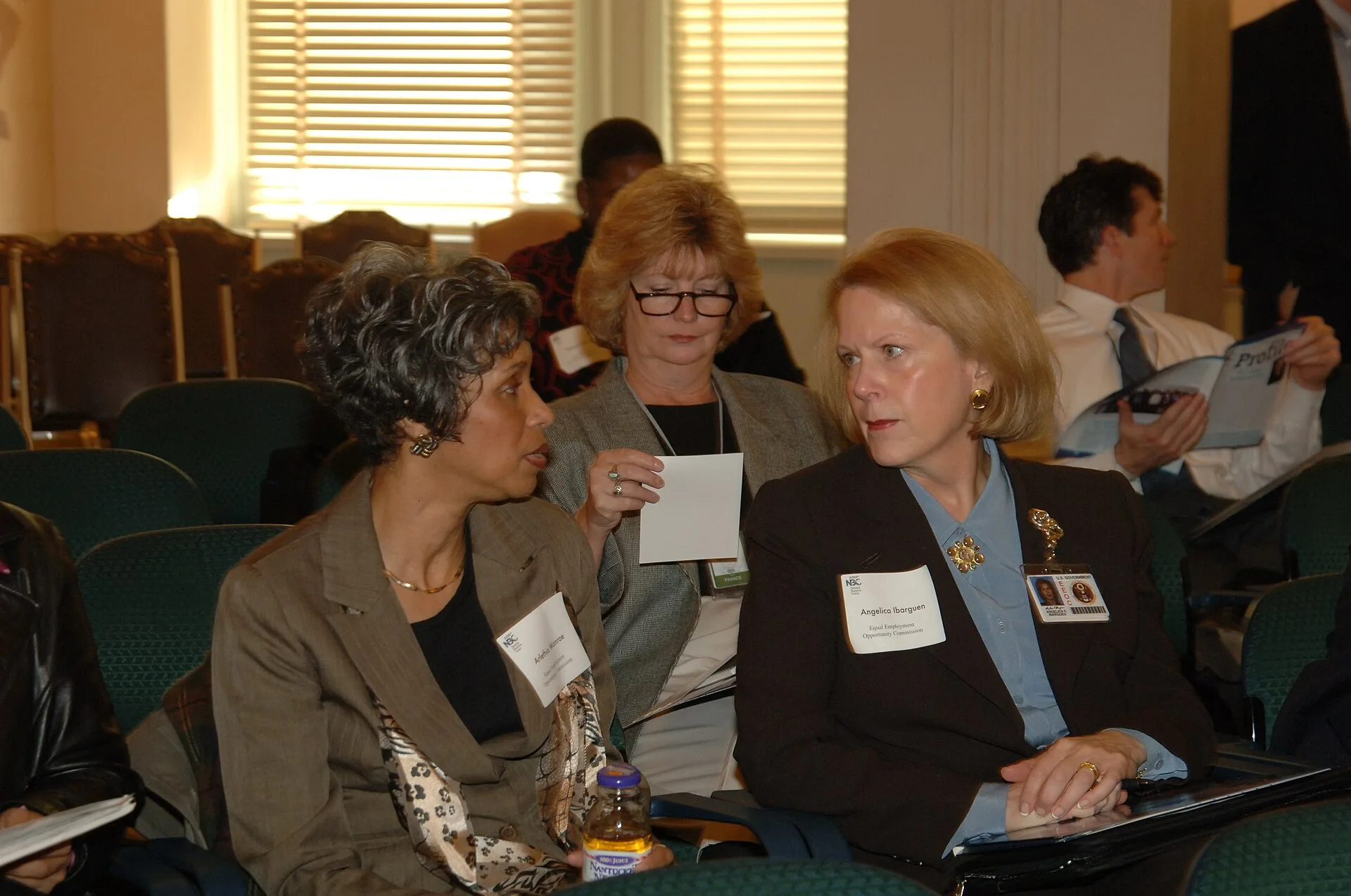 Complete assignment is listed as: Subject: National Business Center customer service meeting, [led by Center Director Douglas Bourgeois] Photographer: Tami Heilemann--Interior Staff