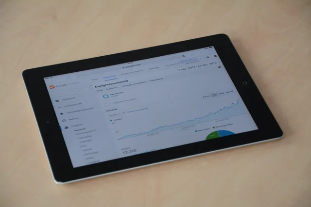 A digital tablet showing a web analytics dashboard with graphs and charts. Affiliate marketing tools and providers for your programme